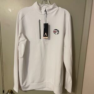 White top with zip up neck and side pocket